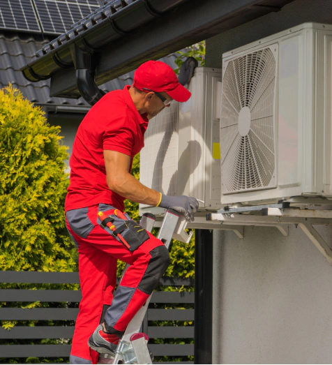 hvac worker performing preventive maintenance on hvac