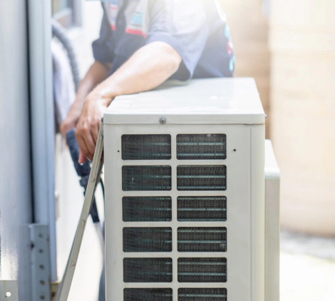 repairman washing dirty compartments air conditioning unit